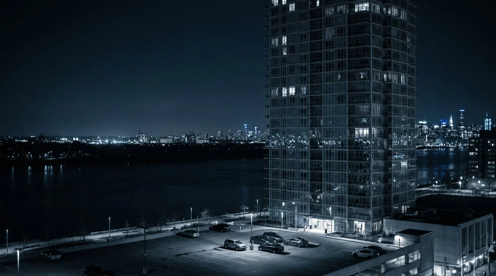 A waterfront view across the water toward a city skyline